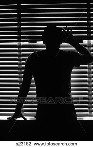 Rear View Silhouette Of Anonymous Man Peeking Through Venetian Blinds View Large Photo Image Stock Image - Rear View Silhouette Of Anonymous Man Peeking Through Venetian Blinds . Fotosearch
