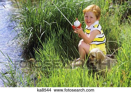 Redheaded Boy Fishing From Bank With Cocker Spaniel Beside Him View Large Photo Image Picture - Redheaded Boy Fishing From Bank With Cocker Spaniel Beside Him. Fotosearch