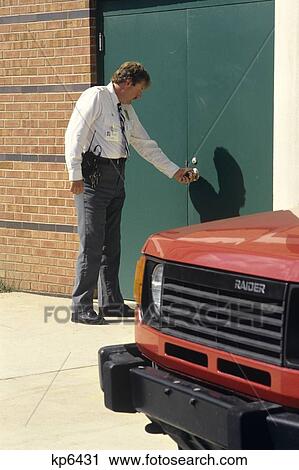 Security Guard Checking Door Of Hospital View Large Photo Image Stock Image - Security Guard Checking Door Of Hospital . Fotosearch