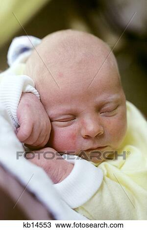 Stock Image - Sleeping Baby Head And Hands Close -Up. Fotosearch