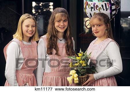 Stock Photo - Three Teenage Hospital Volunteers . Fotosearch