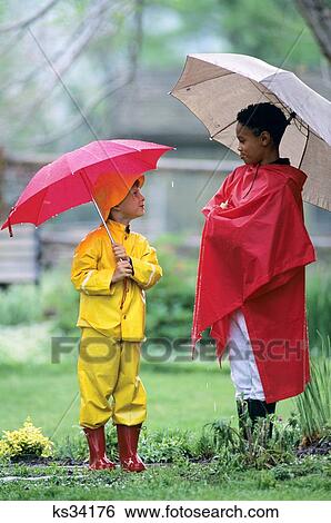 Two Children Wearing Slickers In Rain View Large Photo Image Stock Photograph - Two Children Wearing Slickers In Rain . Fotosearch