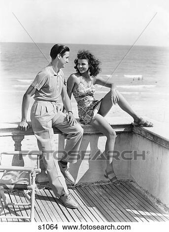 1930S 1940S Couple On Hotel Deck Flirting Florida Usa View Large Photo Image Picture - 1930S 1940S Couple On Hotel Deck Flirting Florida Usa. Fotosearch