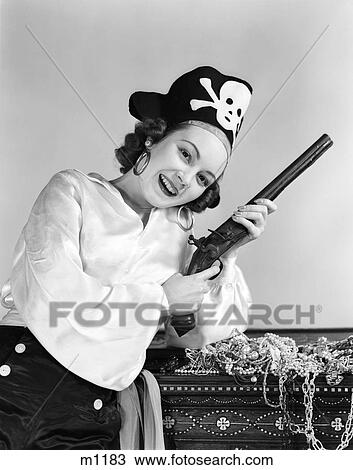 1940S Woman Wearing Pirate Costume Holding Flintlock Pistol Leaning On Treasure Trunk Smiling Looking At Camera View Large Photo Image Stock Image - 1940S Woman Wearing Pirate Costume Holding Flintlock Pistol Leaning On Treasure Trunk Smiling Looking At Camera. Fotosearch