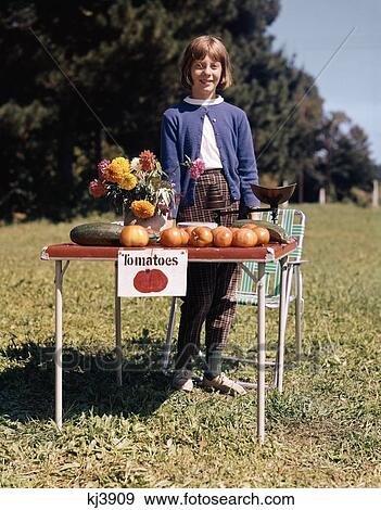 1950S 1960S Girl Selling Fresh Garden Tomatoes Corn Zucchini Flowers Looking At Camera View Large Photo Image Stock Photo - 1950S 1960S Girl Selling Fresh Garden Tomatoes Corn Zucchini Flowers Looking At Camera. Fotosearch