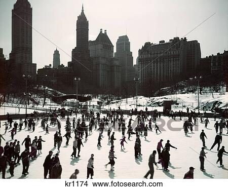 Picture - 1950S Large Number Of People Ice Skating On Wollman Rink Central Park Manhattan New York City Usa. Fotosearch