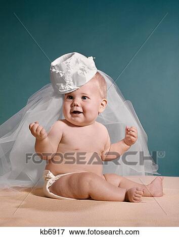 1960S Baby Bride Wearing Bridal Veil And Cloth Diaper View Large Photo Image Stock Photo - 1960S Baby Bride Wearing Bridal Veil And Cloth Diaper. Fotosearch