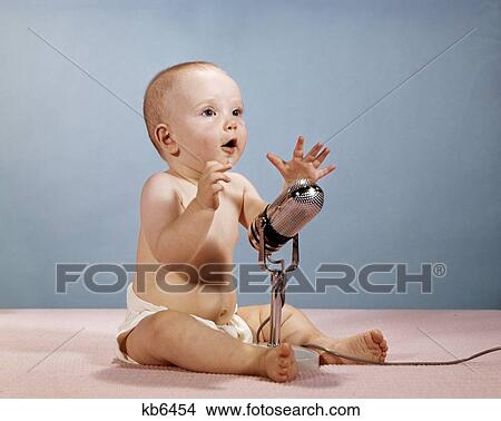 1960S Baby Talking Singing Into Microphone View Large Photo Image Picture - 1960S Baby Talking Singing Into Microphone. Fotosearch