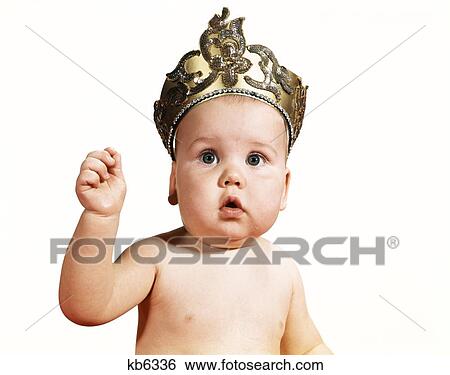 Stock Photograph - 1960S Baby Wearing Crown Tiara Raised Arm Looking At Camera . Fotosearch