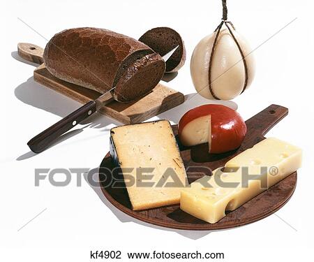 1960S Brown Bread And Cheeses On Cutting Board Gouda Swiss Cheddar Provolone View Large Photo Image Stock Image - 1960S Brown Bread And Cheeses On Cutting Board Gouda Swiss Cheddar Provolone. Fotosearch