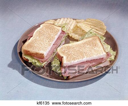 1960S Ham Sandwich On Toast With Lettuce On Plate With Chips View Large Photo Image Stock Photography - 1960S Ham Sandwich On Toast With Lettuce On Plate With Chips. Fotosearch