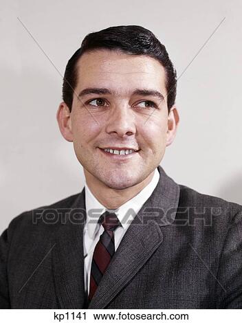1960S Portrait Smiling Young Man Wearing Suit And Tie Looking To Side View Large Photo Image Stock Image - 1960S Portrait Smiling Young Man Wearing Suit And Tie Looking To Side . Fotosearch