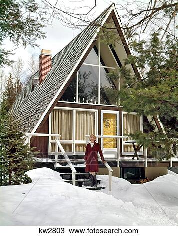 1960S Woman Standing On Steps Of A-Frame Ski Lodge House Surrounded By Winter Snow View Large Photo Image Stock Image - 1960S Woman Standing On Steps Of A-Frame Ski Lodge House Surrounded By Winter Snow . Fotosearch