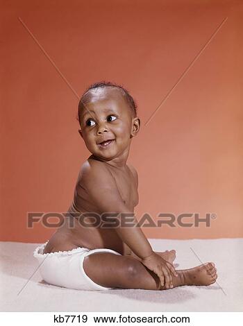 1970S African American Baby Wearing Cloth Diaper Looking Back Over Shoulder View Large Photo Image Stock Photo - 1970S African American Baby Wearing Cloth Diaper Looking Back Over Shoulder. Fotosearch