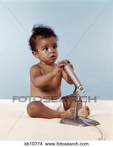1970S African American Baby With Microphone View Large Photo Image Picture - 1970S African American Baby With Microphone. Fotosearch