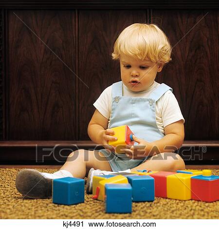 1970S Blond Boy Toddler Playing With Blocks View Large Photo Image Stock Image - 1970S Blond Boy Toddler Playing With Blocks . Fotosearch