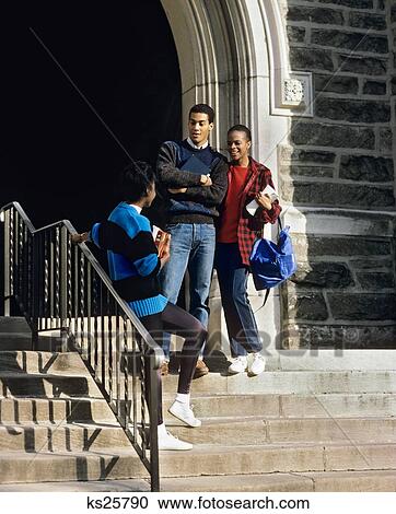 1980S Three African American Students Meeting And Talking On School Steps View Large Photo Image Stock Image - 1980S Three African American Students Meeting And Talking On School Steps. Fotosearch