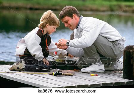 Man And Boy Father And Son Fishing On Dock View Large Photo Image Stock Photograph - Man And Boy Father And Son Fishing On Dock. Fotosearch