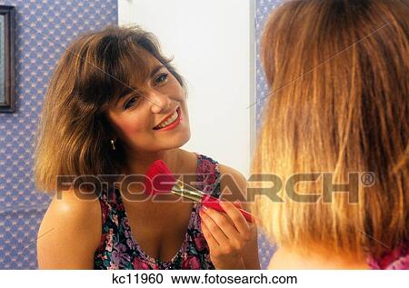 Woman At Bathroom Mirror Applying Makeup View Large Photo Image Stock Image - Woman At Bathroom Mirror Applying Makeup. Fotosearch