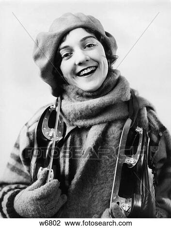1920S 1930S Smiling Woman Dressed For Winter Looking At Camera Pair Of Ice Skates Over Her Shoulders View Large Photo Image Stock Image - 1920S 1930S Smiling Woman Dressed For Winter Looking At Camera Pair Of Ice Skates Over Her Shoulders. Fotosearch