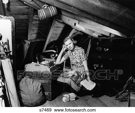 1930S 1940S Distraught Looking Young Woman In Attic Reading Through Old Letters View Large Photo Image Stock Photo - 1930S 1940S Distraught Looking Young Woman In Attic Reading Through Old Letters . Fotosearch