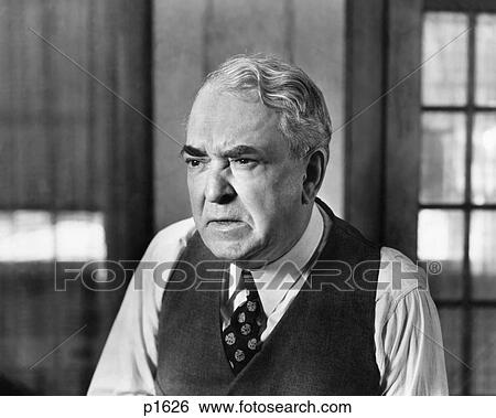 1930S 1940S Elderly Business Man Vest Tie Character Worried Serious Facial Expression Grumpy Mean Angry View Large Photo Image Stock Photograph - 1930S 1940S Elderly Business Man Vest Tie Character Worried Serious Facial Expression Grumpy Mean Angry. Fotosearch