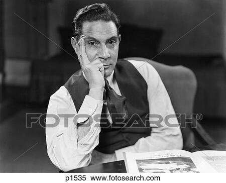 1930S 1940S Man Seated Elbows On Table Face Leaning On Hand Serious Expression Wearing Shirt Tie Vest Looking At Camera View Large Photo Image Stock Photography - 1930S 1940S Man Seated Elbows On Table Face Leaning On Hand Serious Expression Wearing Shirt Tie Vest Looking At Camera . Fotosearch