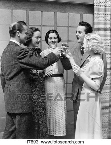 1930S 1940S Party Group Friends Two Men Three Women Toasting Drinking Liquor View Large Photo Image Stock Image - 1930S 1940S Party Group Friends Two Men Three Women Toasting Drinking Liquor. Fotosearch