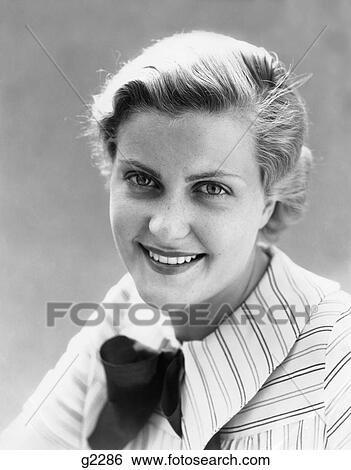 1930S Freckle Faced Woman Smiling At Camera Wearing Striped Shirt With Bow Outdoors View Large Photo Image Stock Photograph - 1930S Freckle Faced Woman Smiling At Camera Wearing Striped Shirt With Bow Outdoors . Fotosearch