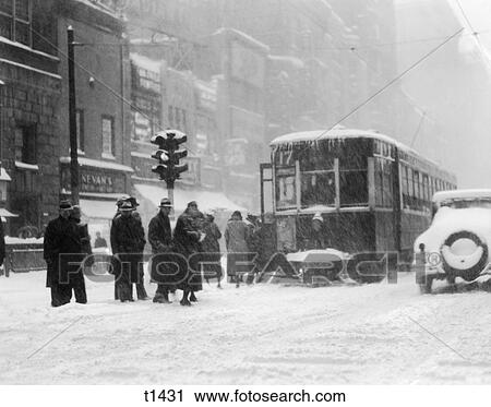 1930S Pedestrians On Snow Covered Icy Winter Street In Philadelphia Getting On Trolley Car By Traffic Light View Large Photo Image Stock Image - 1930S Pedestrians On Snow Covered Icy Winter Street In Philadelphia Getting On Trolley Car By Traffic Light. Fotosearch