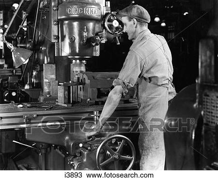 1940S Man Worker Operating Large Machine In Factory View Large Photo Image Stock Image - 1940S Man Worker Operating Large Machine In Factory . Fotosearch