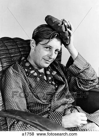 1940S Smiling Man With Hangover Headache Looking At Camera Ice Bag On His Head Wearing Silk Pajamas And Robe View Large Photo Image Stock Photo - 1940S Smiling Man With Hangover Headache Looking At Camera Ice Bag On His Head Wearing Silk Pajamas And Robe. Fotosearch