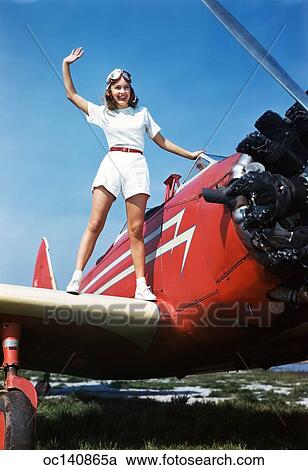 old time pilot helmet on girl