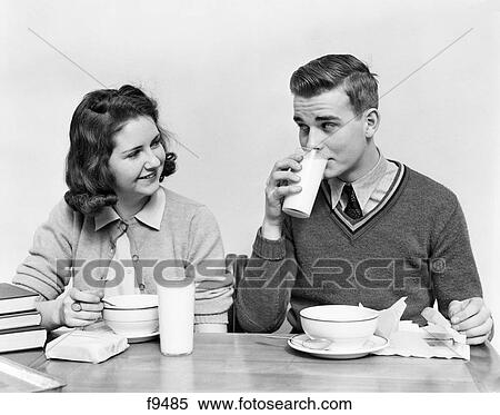 1940S Teenage Girl And Boy Eating School Lunch Soup Sandwiches Together Boy Drinking Milk View Large Photo Image Stock Photography - 1940S Teenage Girl And Boy Eating School Lunch Soup Sandwiches Together Boy Drinking Milk. Fotosearch