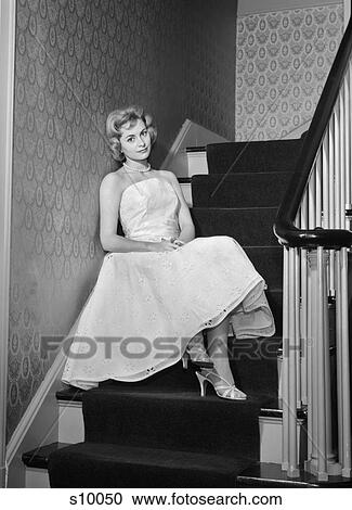 1950S 1960S Woman Formal Cocktail Dress Sitting On Stairs Looking Sad Waiting For Date Stood Up View Large Photo Image Stock Image - 1950S 1960S Woman Formal Cocktail Dress Sitting On Stairs Looking Sad Waiting For Date Stood Up. Fotosearch