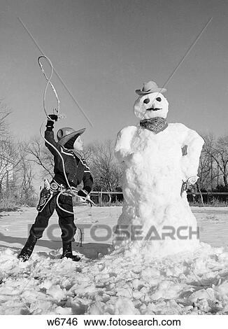 1950S Boy In Cowboy Costume Ready To Lasso Cowboy Snowman Outdoor View Large Photo Image Stock Photograph - 1950S Boy In Cowboy Costume Ready To Lasso Cowboy Snowman Outdoor . Fotosearch