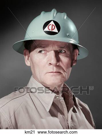 1950S Portrait Man Wearing Hard Hat With Civil Defense Logo View Large Photo Image Stock Image - 1950S Portrait Man Wearing Hard Hat With Civil Defense Logo. Fotosearch