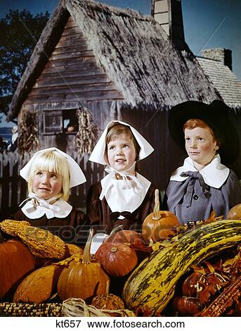 1960S 3 Kids Dressed In Pilgrim Costumes Clothes For Thanskgiving Composite With Plimouth Colony Background And Pumpkins View Large Photo Image Stock Photo - 1960S 3 Kids Dressed In Pilgrim Costumes Clothes For Thanskgiving Composite With Plimouth Colony Background And Pumpkins . Fotosearch