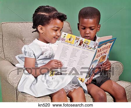 1960S African American Boy And Girl Sitting In Easy Chair Reading Book Of Mother Goose Rhymes View Large Photo Image Stock Image - 1960S African American Boy And Girl Sitting In Easy Chair Reading Book Of Mother Goose Rhymes. Fotosearch
