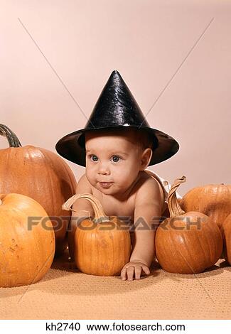 1960S Baby In Witch Hat Crawlilng Over Pumpkins View Large Photo Image Stock Image - 1960S Baby In Witch Hat Crawlilng Over Pumpkins . Fotosearch