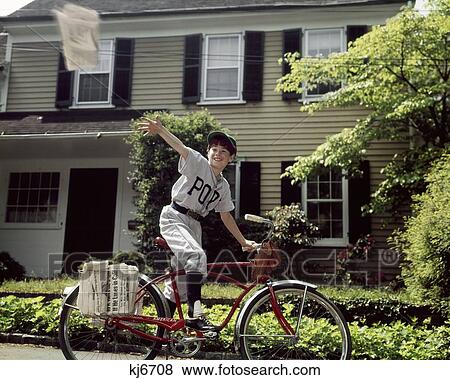 1960S Boy In Baseball Uniform Riding Bicycle Delivering Newspapers View Large Photo Image Stock Photo - 1960S Boy In Baseball Uniform Riding Bicycle Delivering Newspapers. Fotosearch
