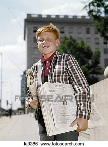 1960S Smiling Boy Red Hair Wearing Plaid Jacket Selling Newspapers On Sidewalk View Large Photo Image Stock Photograph - 1960S Smiling Boy Red Hair Wearing Plaid Jacket Selling Newspapers On Sidewalk. Fotosearch