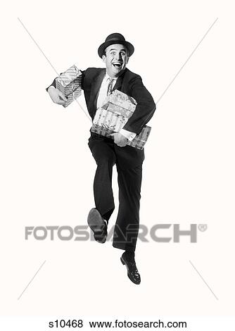 1960S Smiling Happycamera Carrying Arms Full Of Packages Presents Gifts View Large Photo Image Stock Photo - 1960S Smiling Happycamera Carrying Arms Full Of Packages Presents Gifts. Fotosearch