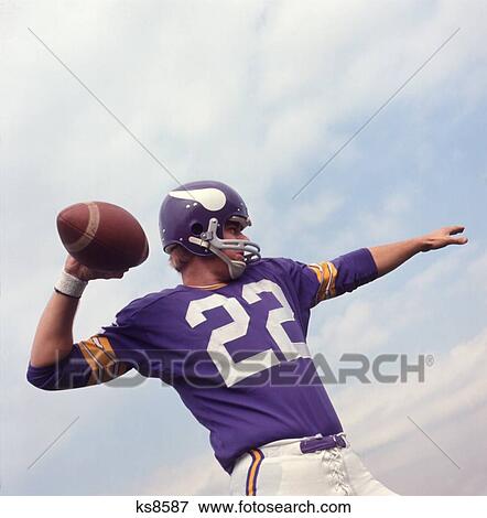 1970S Amateur American Football Player Purple Jersey 22 About To Throw The Ball View Large Photo Image Stock Photo - 1970S Amateur American Football Player Purple Jersey 22 About To Throw The Ball. Fotosearch