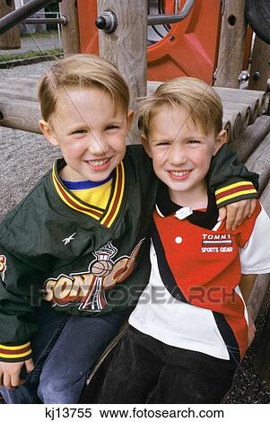 Four Year Old Twin Brothers At Playground Looking At Camera View Large Photo Image Stock Photography - Four Year Old Twin Brothers At Playground Looking At Camera. Fotosearch
