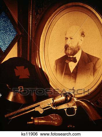 Stock Photograph - 1860s AMERICAN CIVIL WAR PISTOL UNION KEPI HAT PHOTOGRAPH OF VETERAN SOLDIER. Fotosearch