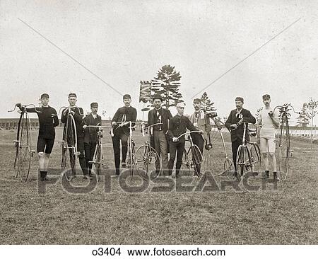 1870s 1880s 1890s NINE LATE 19TH CENTURY MEN LINED UP WITH OLD FASHIONED HIGH WHEEL PENNY-FARTHING BICYCLES LOOKING AT CAMERA View Large Photo Image Picture - 1870s 1880s 1890s NINE LATE 19TH CENTURY MEN LINED UP WITH OLD FASHIONED HIGH WHEEL PENNY-FARTHING BICYCLES LOOKING AT CAMERA. Fotosearch