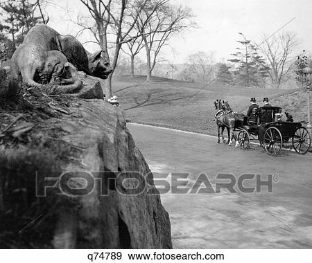 1880s 1890s HORSE CARRIAGE PASSING THE STILL HUNT PANTHER SCULPTURE BY EDWARD KEMEYS EAST DRIVE CENTRAL PARK MANHATTAN NYC USA View Large Photo Image Stock Photo - 1880s 1890s HORSE CARRIAGE PASSING THE STILL HUNT PANTHER SCULPTURE BY EDWARD KEMEYS EAST DRIVE CENTRAL PARK MANHATTAN NYC USA. Fotosearch