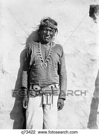 1890 1890s PORTRAIT NATIVE AMERICAN HOPI INDIAN MAN SMILING WEARING SQUASH BLOSSOM NECKLACE LOOKING AT CAMERA View Large Photo Image Stock Image - 1890 1890s PORTRAIT NATIVE AMERICAN HOPI INDIAN MAN SMILING WEARING SQUASH BLOSSOM NECKLACE LOOKING AT CAMERA. Fotosearch