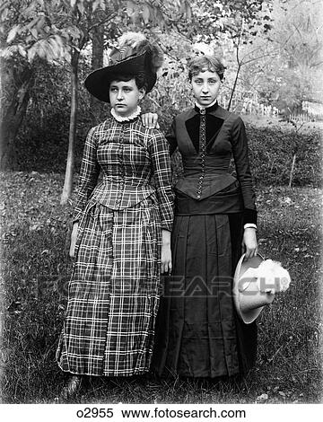 1890 1890S Portrait Two Teenaged Girls Standing In Backyard Lawn One Girls Hand On Other Girls Shoulder View Large Photo Image Stock Photography - 1890 1890S Portrait Two Teenaged Girls Standing In Backyard Lawn One Girls Hand On Other Girls Shoulder . Fotosearch